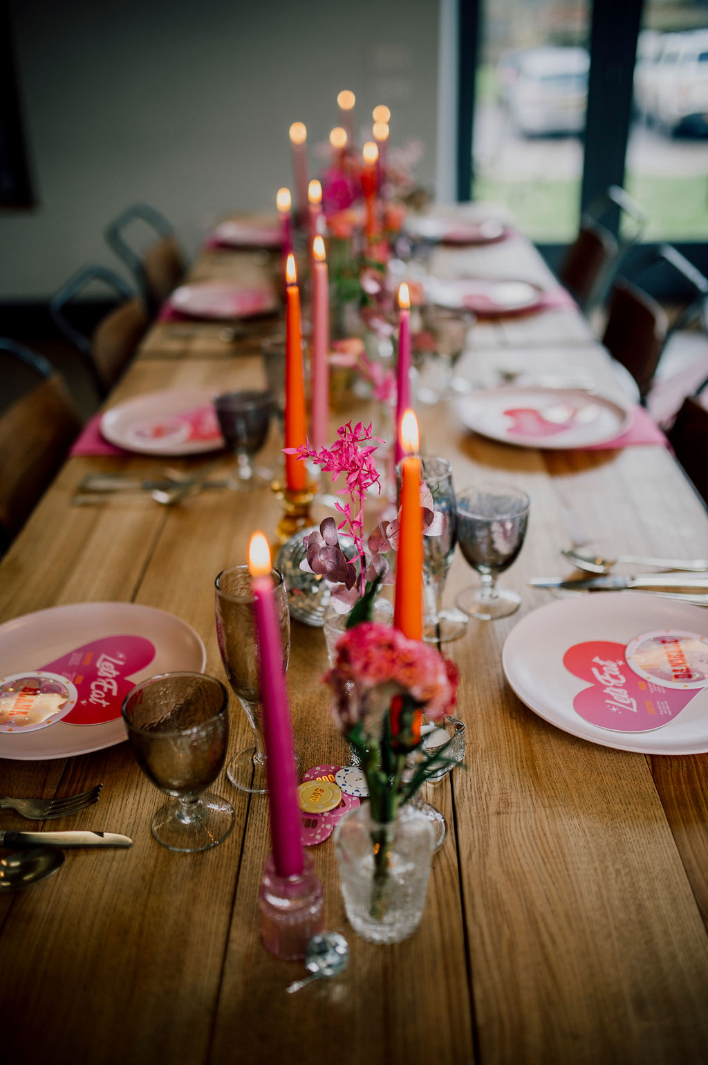 Wedding reception at Achnagairn Castle with black table cloth, rich toned florals and red and pink candles