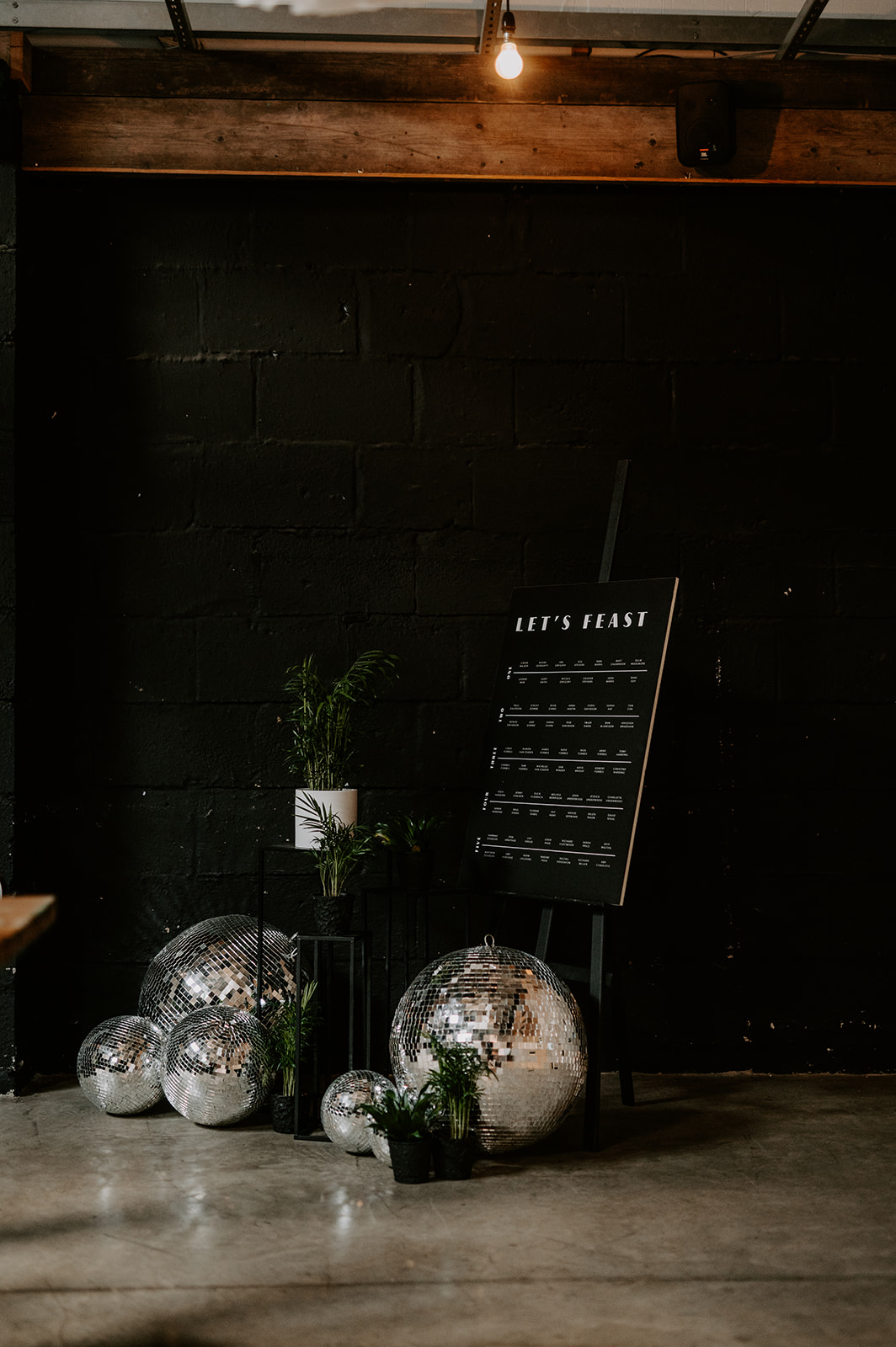 black and white table plan styled with large disco balls
