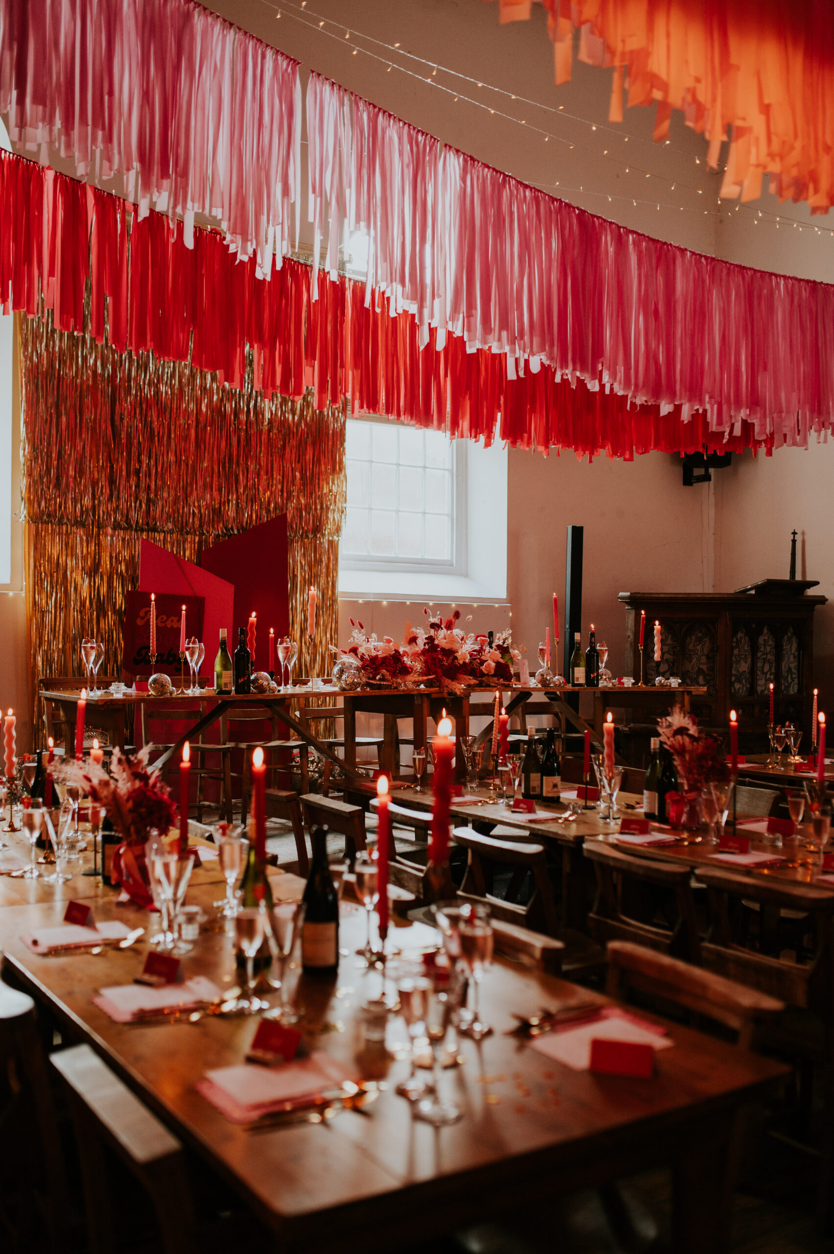 red and pink wedding table styling at the globe