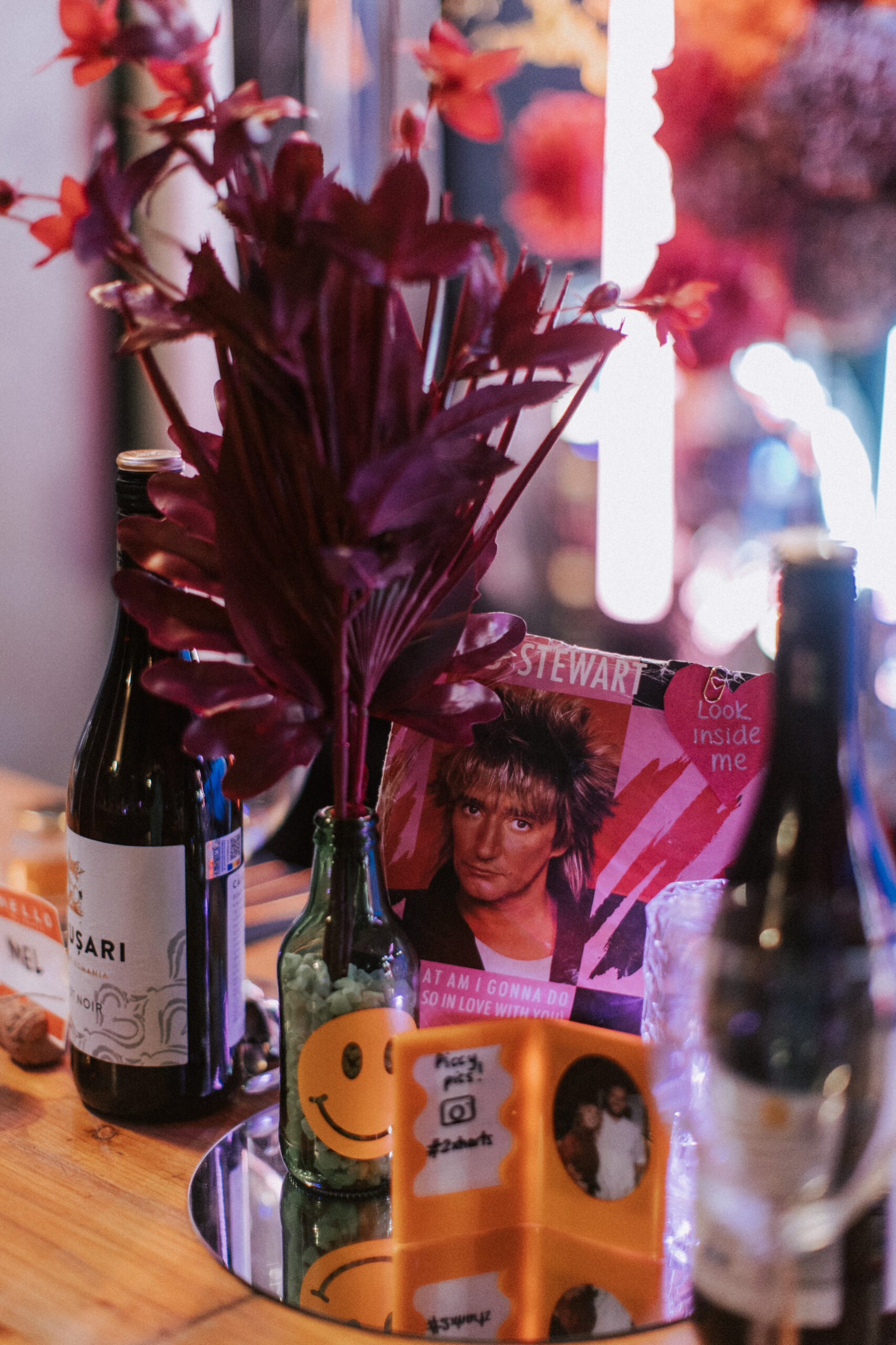 alternative wedding table with record player and beer bottles